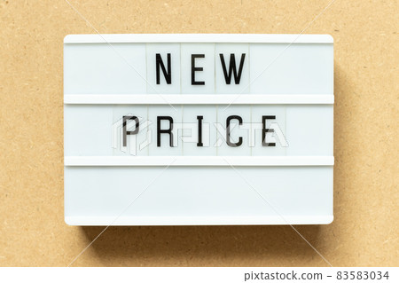 Lightbox with word new price on wood background Lightbox with word new price on wood background 83583034