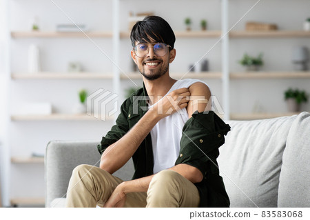 Cheerful middle eastern man got vaccinated against COVID-19 Cheerful middle eastern man got vaccinated against COVID-19 83583068