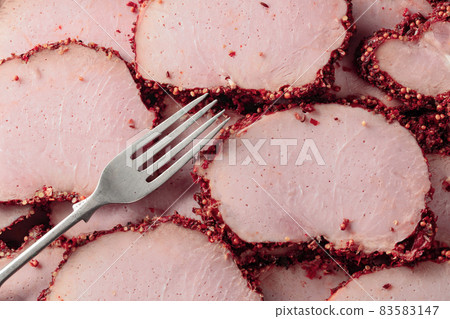 Slices of spicy smoked ham. 83583147
