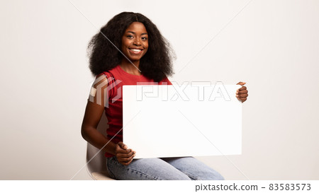 Vaccination Campaign Ad. Vaccinated Black Woman Holding Blank Placard In Her Hands 83583573