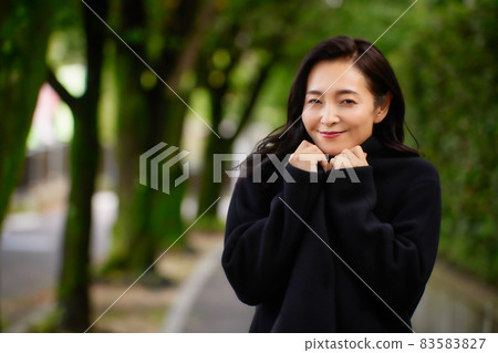 A woman in a coat A woman in a coat 83583827