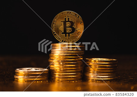Cryptocurrency Growth Over Stacked Gold Bitcoin Coins Cryptocurrency Growth Over Stacked Gold Bitcoin Coins 83584320