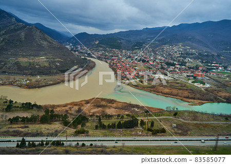 Amazing natural landscape. The confluence of two rivers in the city of Mtskheta in Georgia Amazing natural landscape. The confluence of two rivers in the city of Mtskheta in Georgia 83585077