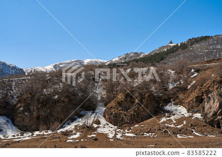 Gergeti Orthodox Church of the Holy Trinity in the mountains of Georgia. An authentic spiritual place 83585222