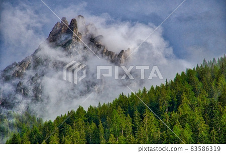 Mount Pollice shrouded in mist 83586319