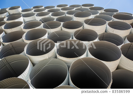 Downpipe warehouse. Steel pipes, parts for the construction of a roof drainage system in a warehouse 83586599
