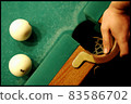 Billiard balls lie on the table near the pocket 83586702