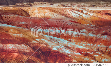 Red mountains of Altai region. Close-up of the rock Red mountains of Altai region. Close-up of the rock 83587558