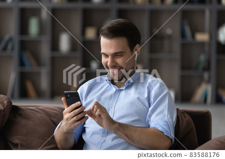 Happy millennial man holding video call conversation. Happy millennial man holding video call conversation. 83588176