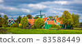 Panoramia of the Dutch village Zaanse Schans near Amsterdam. Typical Dutch green houses and windmills. 83588449