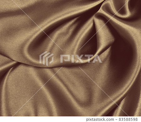 Smooth elegant brown silk or satin texture as abstract background. Luxurious background design. In Sepia toned. Retro style Smooth elegant brown silk or satin texture as abstract background. Luxurious background design. In Sepia toned. Retro style 83588598
