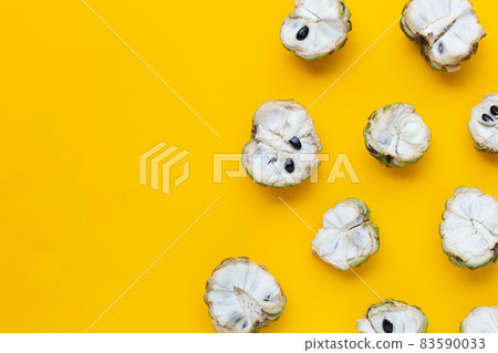 Custard apple on yellow background. Custard apple on yellow background. 83590033
