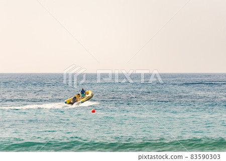 Pathos. Cyprus. The November 2019. Motor boat and jet ski. People have fun on vacation. Pathos. Cyprus. The November 2019. Motor boat and jet ski. People have fun on vacation. 83590303