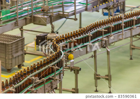 Beer production. Beverage bottling line. Plastic bottles in the factory. Conveyor beer bottles. 83590361