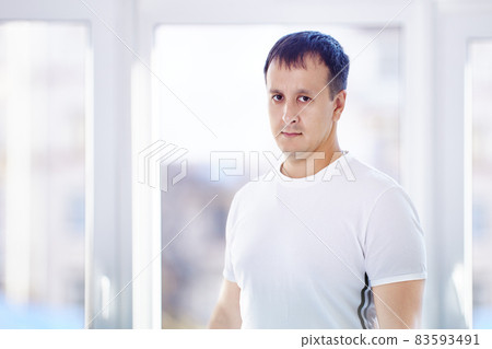 Mixed race man 38 years old stands at home. Mixed race man 38 years old stands at home. 83593491