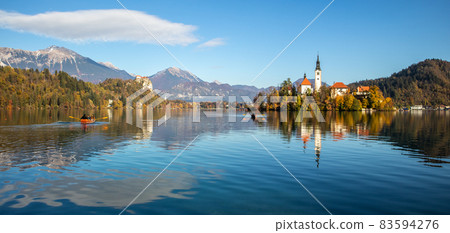 Panoramic view of Julian Alps, Lake Bled with St. Marys Church of the Assumption on the small island. Bled, Slovenia, Europe. Panoramic view of Julian Alps, Lake Bled with St. Marys Church of the Assumption on the small island. Bled, Slovenia, Europe. 83594276