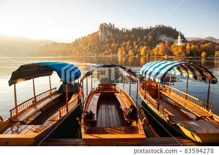 Traditional wooden boats on lake Bled, Slovenia. Traditional wooden boats on lake Bled, Slovenia. 83594278