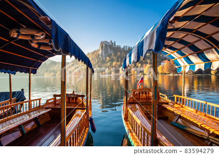 Traditional wooden boats on lake Bled, Slovenia. 83594279
