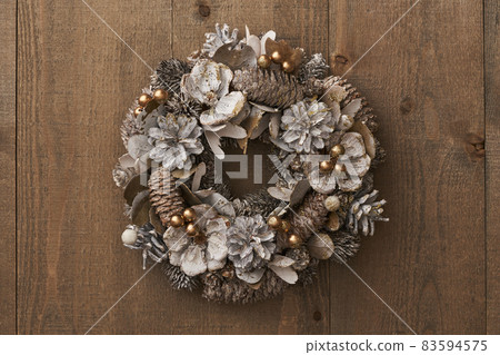 Christmas wreath on a vintage board Christmas wreath on a vintage board 83594575