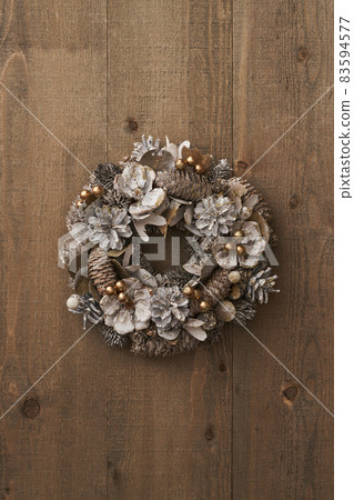 Christmas wreath on a vintage board Christmas wreath on a vintage board 83594577