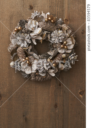 Christmas wreath on a vintage board Christmas wreath on a vintage board 83594579