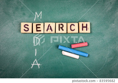 Media and Search concept. Wooden alphabet letters on a green chalk board Media and Search concept. Wooden alphabet letters on a green chalk board 83595682