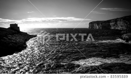 Coast of Gozo at sunset by drone Coast of Gozo at sunset by drone 83595889