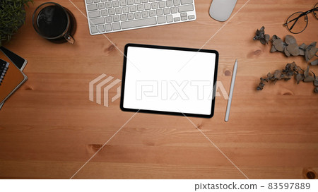 Top view mock up digital tablet with white display on wooden table. Top view mock up digital tablet with white display on wooden table. 83597889