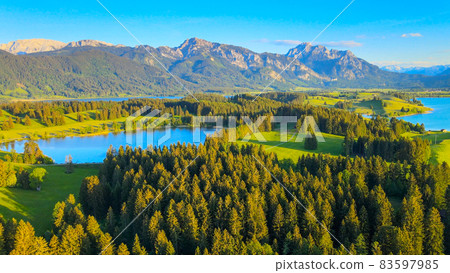 Aerial view over Lake Forggensee at the city of Fuessen in Germany Aerial view over Lake Forggensee at the city of Fuessen in Germany 83597985