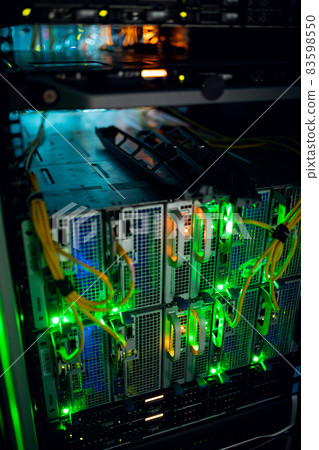 Closeup of computer server with colorful lights and wires Closeup of computer server with colorful lights and wires 83598550
