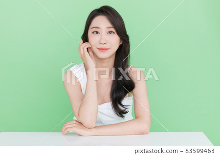 beauty concept, beautiful Korean Asian woman resting chin on hand beauty concept, beautiful Korean Asian woman resting chin on hand 83599463