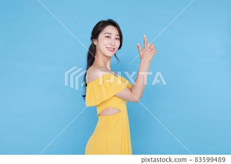 shopping event concept, beautiful Korean Asian woman with pointing finger shopping event concept, beautiful Korean Asian woman with pointing finger 83599489