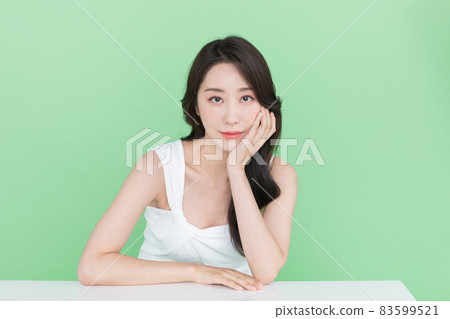 beauty concept, beautiful Korean Asian woman resting chin on hand beauty concept, beautiful Korean Asian woman resting chin on hand 83599521