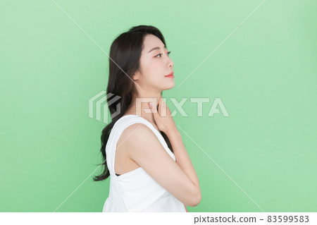 beauty concept, beautiful Korean Asian woman touching neck 83599583