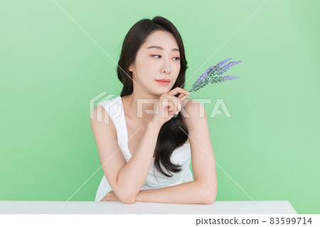 beauty concept, beautiful Korean Asian woman with flower beauty concept, beautiful Korean Asian woman with flower 83599714