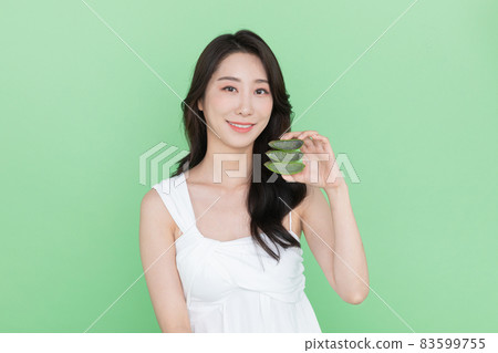 skin beauty concept, beautiful Korean Asian woman holding aloe skin beauty concept, beautiful Korean Asian woman holding aloe 83599755