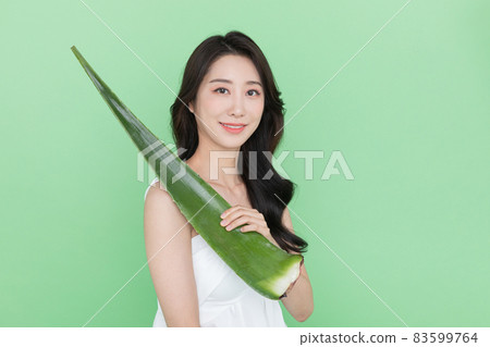 skin beauty concept, beautiful Korean Asian woman holding aloe skin beauty concept, beautiful Korean Asian woman holding aloe 83599764