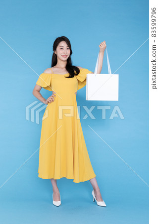 shopping event concept, beautiful Korean Asian woman with shopping bag shopping event concept, beautiful Korean Asian woman with shopping bag 83599796