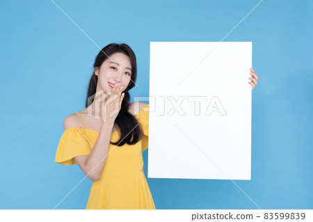 beautiful Korean Asian model with blank signboard, with empty copy space place for some text, advertising or slogan 83599839