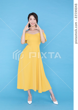 shopping event concept, smiling beautiful Korean Asian woman with hand motion, shouting pose 83599848