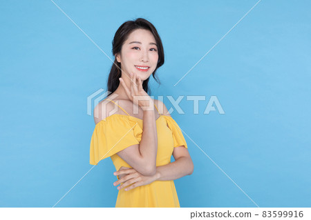 shopping event concept, smiling beautiful Korean Asian woman with hand near face shopping event concept, smiling beautiful Korean Asian woman with hand near face 83599916