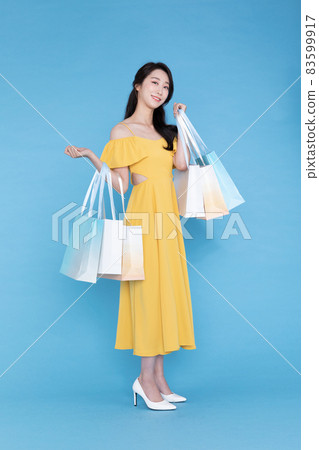 shopping event concept, beautiful Korean Asian woman with shopping bag shopping event concept, beautiful Korean Asian woman with shopping bag 83599917