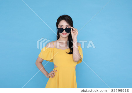 beautiful Korean Asian woman in summer dress wearing shades beautiful Korean Asian woman in summer dress wearing shades 83599918