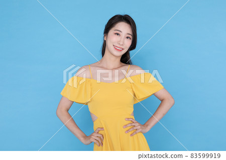 shopping event concept, smiling beautiful Korean Asian woman with hand on waist shopping event concept, smiling beautiful Korean Asian woman with hand on waist 83599919