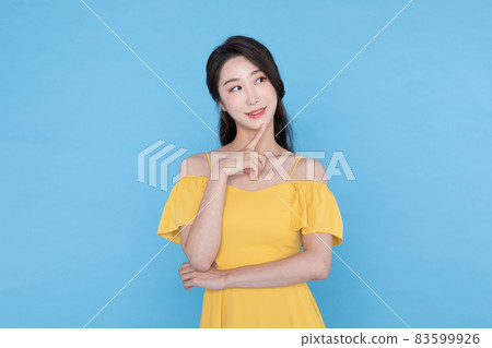 shopping event concept, smiling beautiful Korean Asian woman with hand near face 83599926