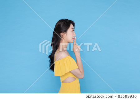 shopping event concept, beautiful Korean Asian woman with one finger on face, telling secret 83599936