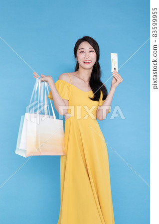shopping event concept, beautiful Korean Asian woman with shopping bag and coupon shopping event concept, beautiful Korean Asian woman with shopping bag and coupon 83599955