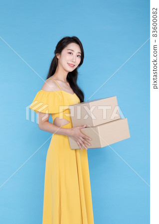 shopping event concept, beautiful Korean Asian woman with delivery box shopping event concept, beautiful Korean Asian woman with delivery box 83600082