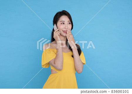 shopping event concept, beautiful Korean Asian woman surpised after receiving smart phone shopping event concept, beautiful Korean Asian woman surpised after receiving smart phone 83600101