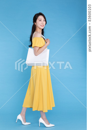 shopping event concept, beautiful Korean Asian woman with shopping bag in shoulder shopping event concept, beautiful Korean Asian woman with shopping bag in shoulder 83600103